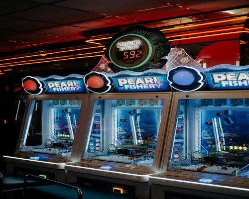 Large indoor gaming technology exhibition hall illuminated with blue light