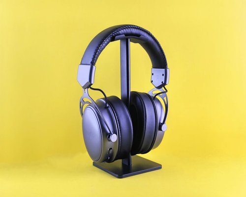 Premium gaming headset resting on an acrylic stand